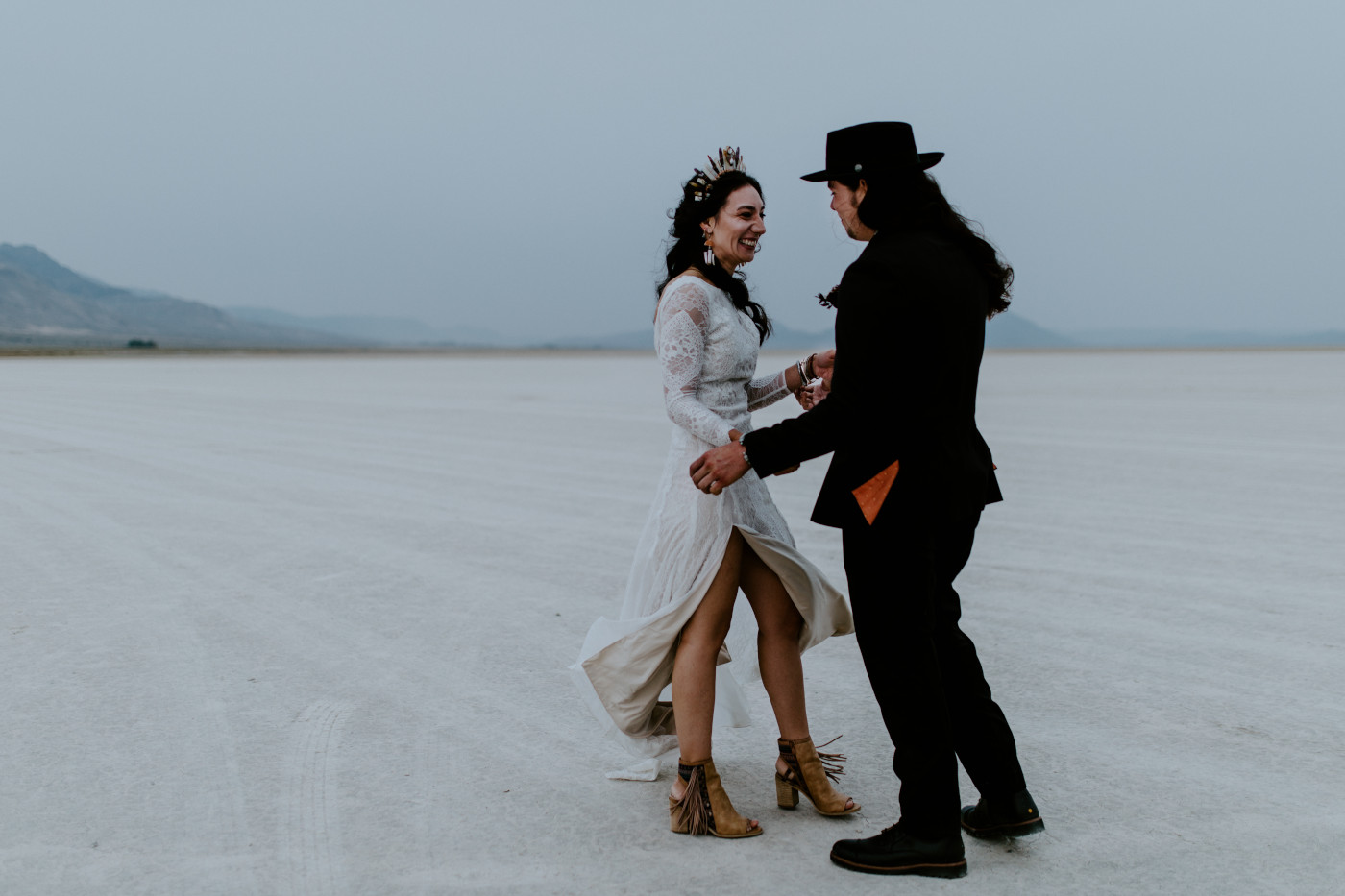 Cameron and Emerald smile at each other during their first look in the Alvord Desert.