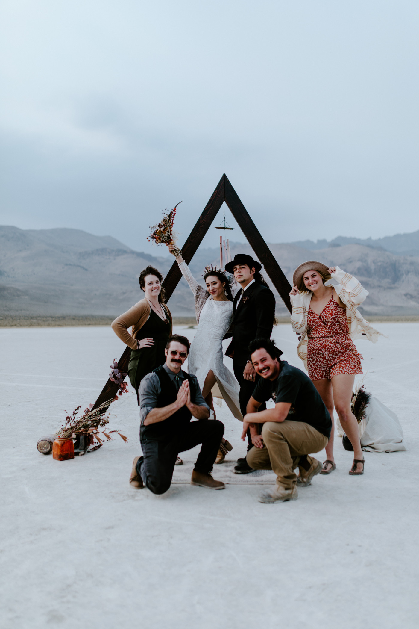 Cameron and Emerald take a picture with all of their elopement guests in the Alvord Desert.