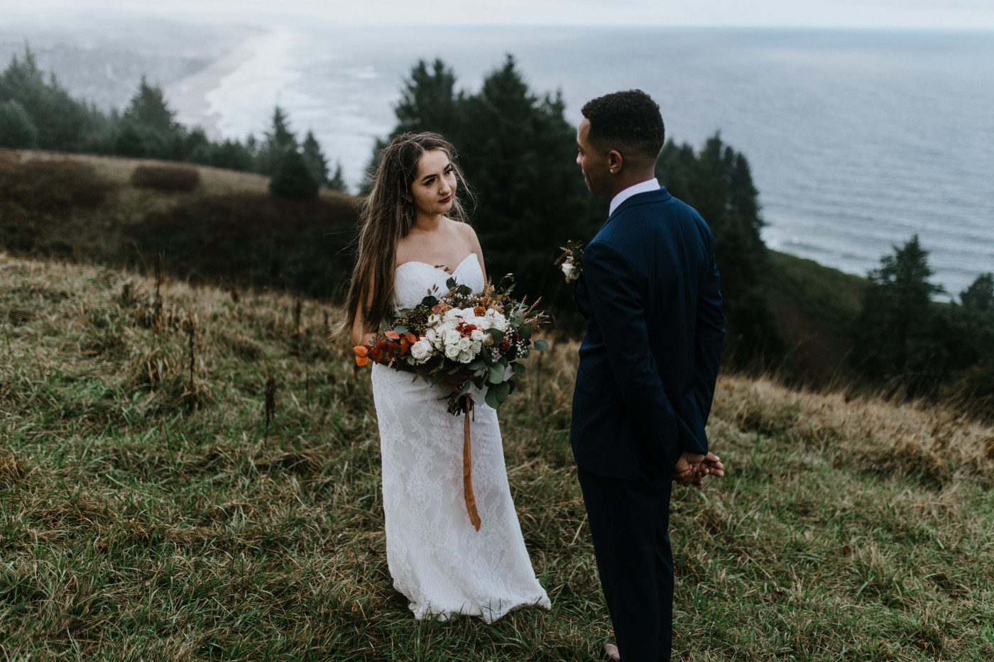 Ariana and Deandre during their elopement with a view of the Oregon coast in the background. Elopement photography at Mount Hood by Sienna Plus Josh.