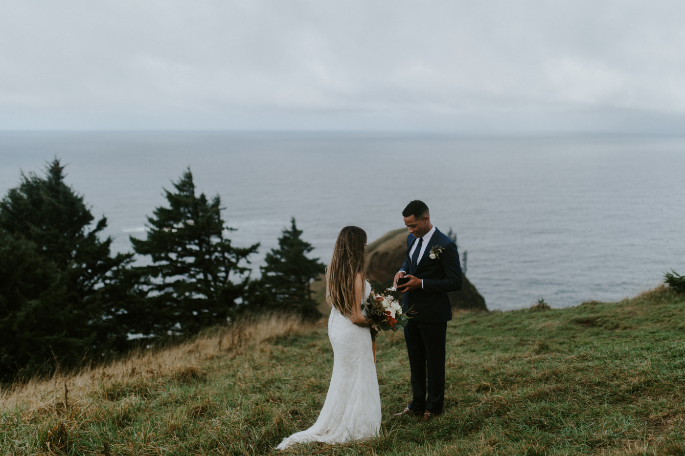 Ariana and Deandre during their elopement ceremony with a view of the coast in the background. Elopement photography at Mount Hood by Sienna Plus Josh.