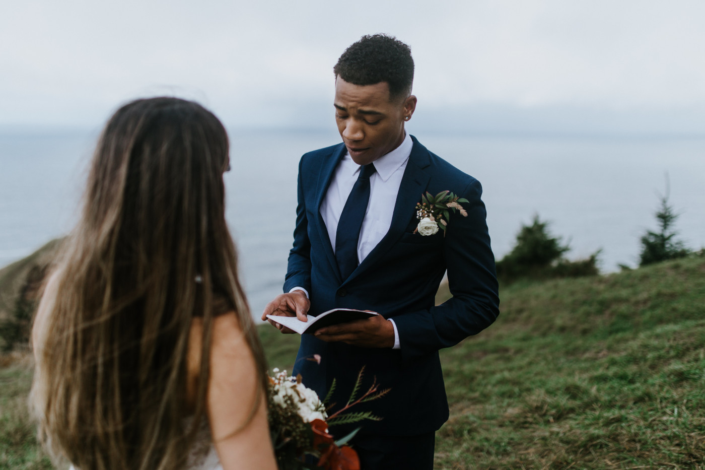 Deandre reads to Ariana. Elopement photography at Mount Hood by Sienna Plus Josh.