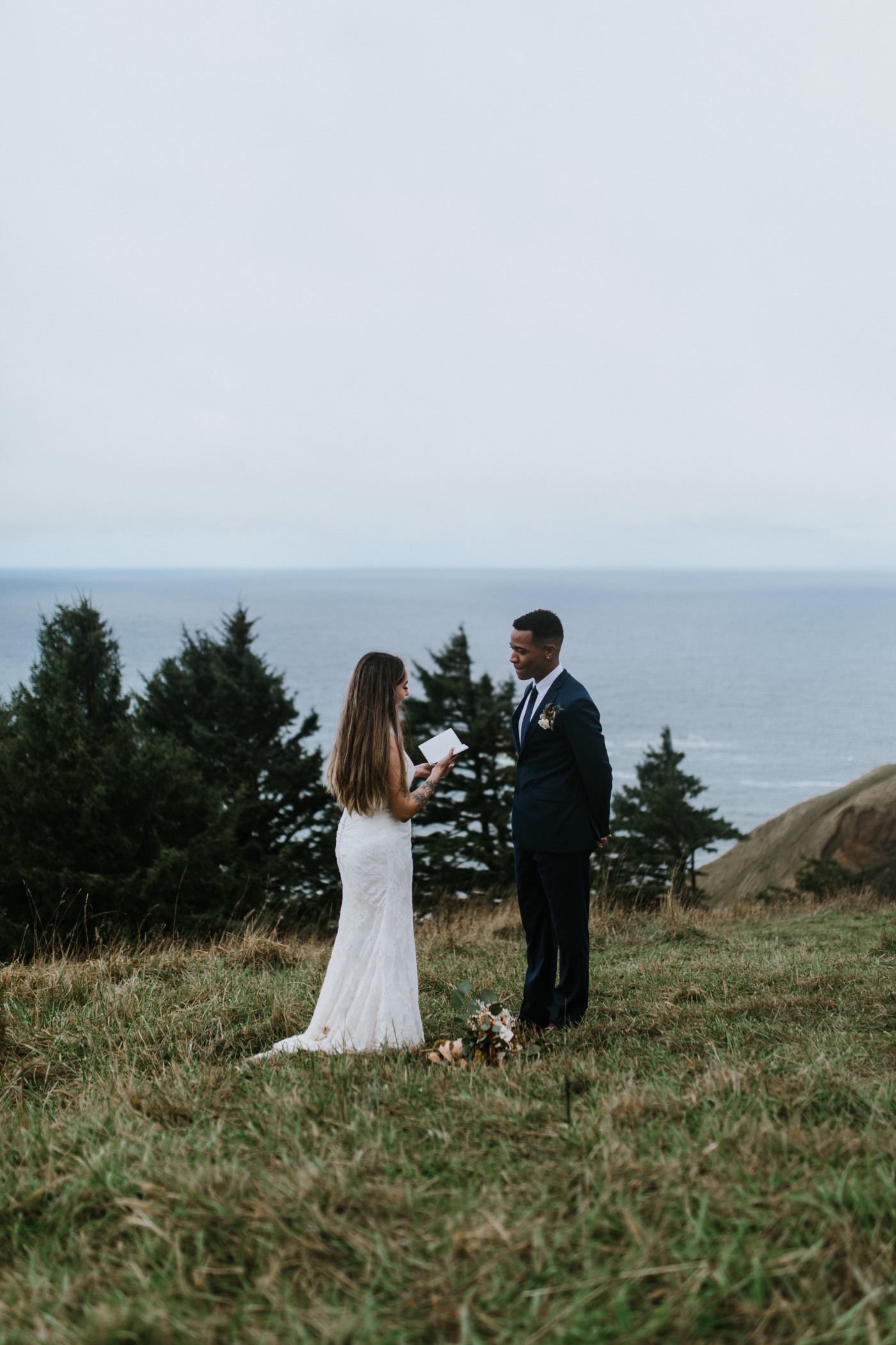 Deandre listens to Ariana during their elopement. Elopement photography at Mount Hood by Sienna Plus Josh.