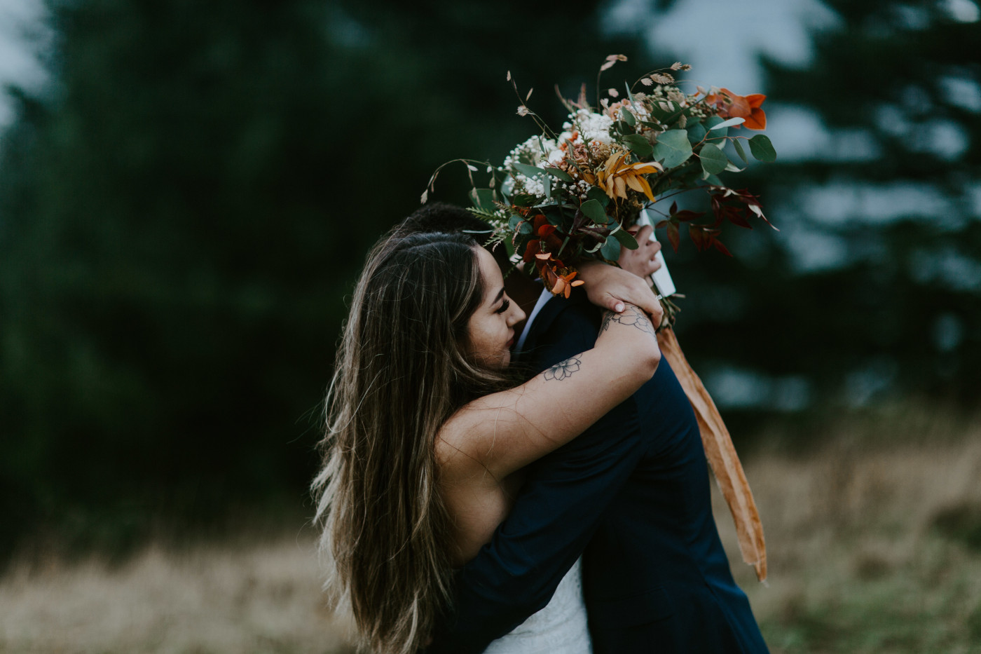 Deandre and Ariana hold each other. Elopement photography at Mount Hood by Sienna Plus Josh.