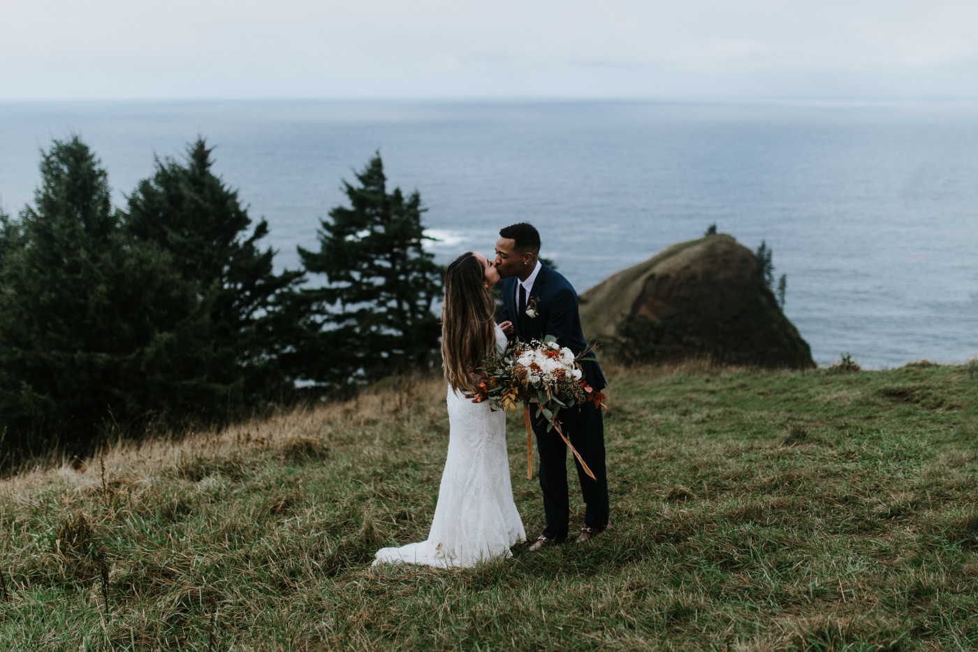 Deandre and Ariana kiss near the Oregon coast. Elopement photography at Mount Hood by Sienna Plus Josh.