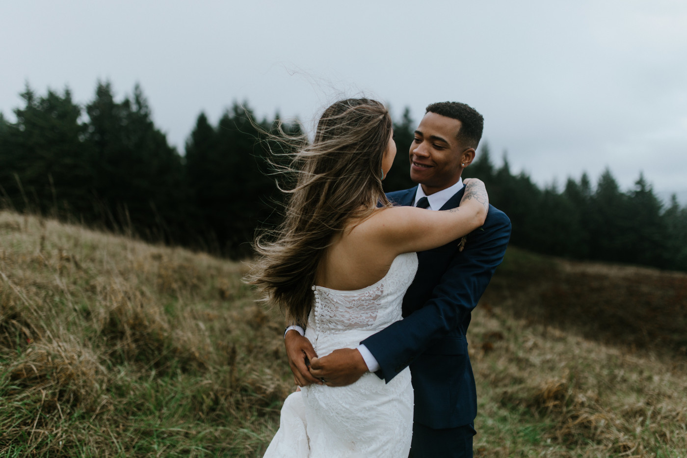 Deandre and Ariana stand in the wind. Elopement photography at Mount Hood by Sienna Plus Josh.