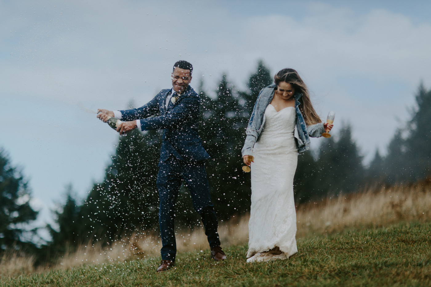 The champagne spray gets crazy. Elopement photography at Mount Hood by Sienna Plus Josh.