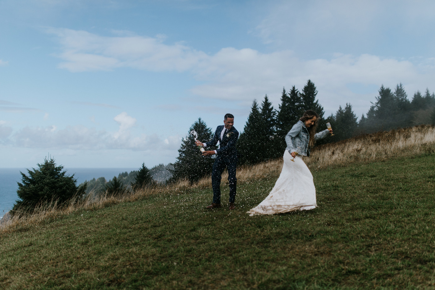 Ariana runs from the spray. Elopement photography at Mount Hood by Sienna Plus Josh.