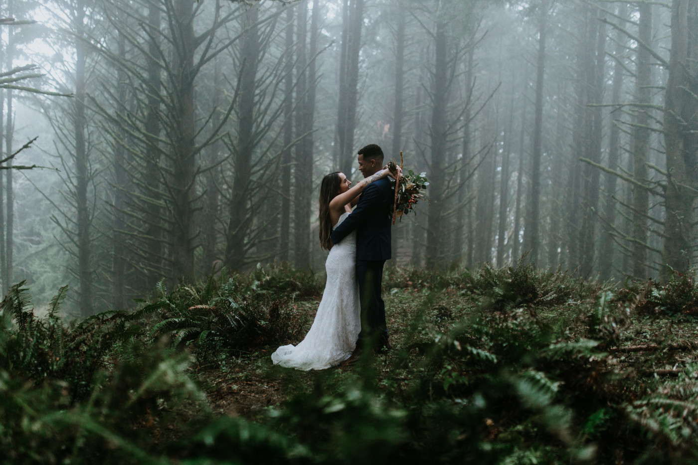 Ariana and Deandre stand in the fog. Elopement photography at Mount Hood by Sienna Plus Josh.