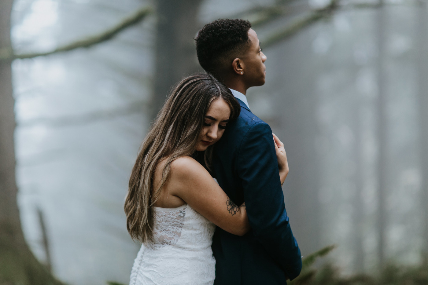 Ariana holds onto Deandre. Elopement photography at Mount Hood by Sienna Plus Josh.