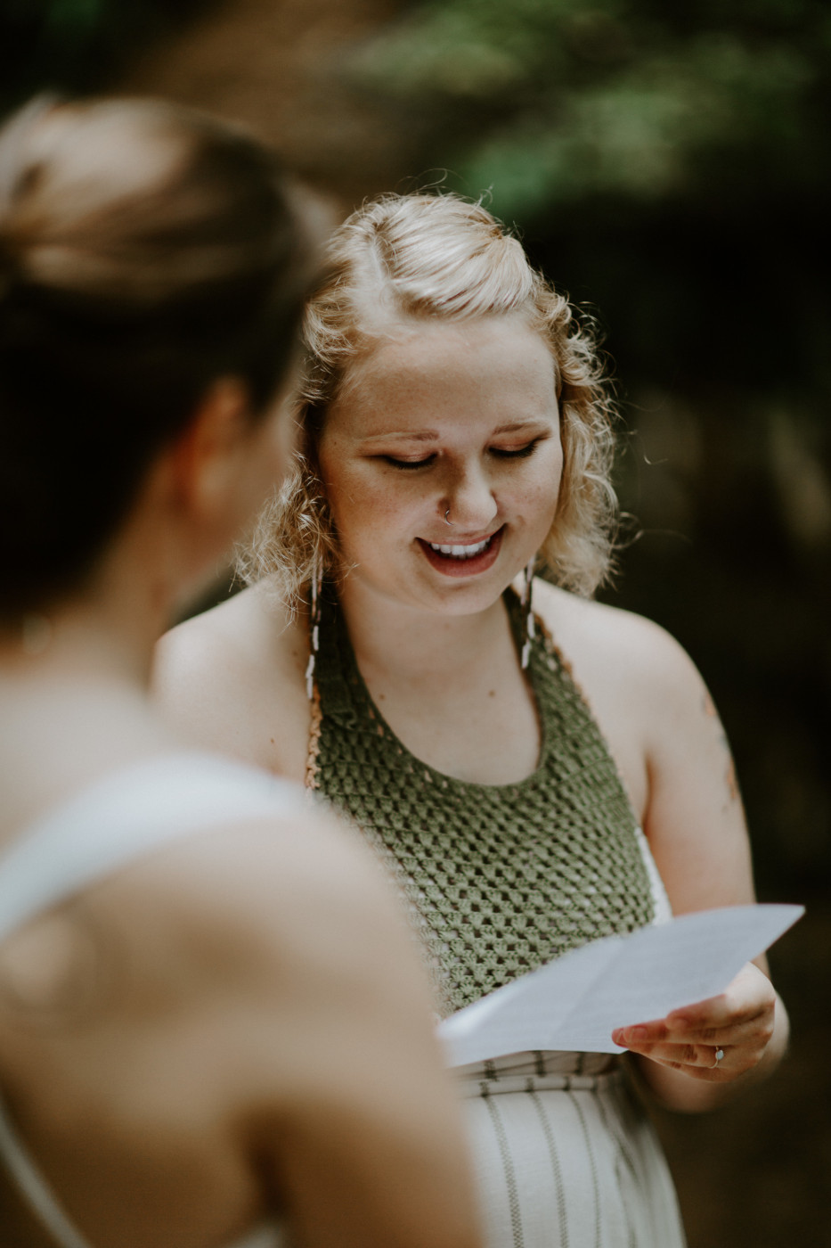 Kate reads her vows to Audrey. Elopement wedding photography at Bridal Veil Falls by Sienna Plus Josh.