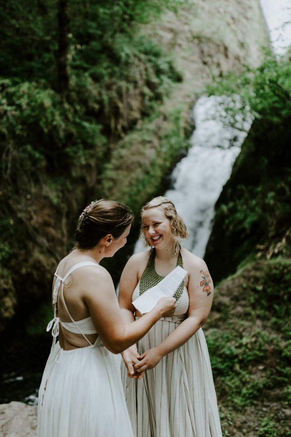 Audrey reads her vows to Kate. Elopement wedding photography at Bridal Veil Falls by Sienna Plus Josh.
