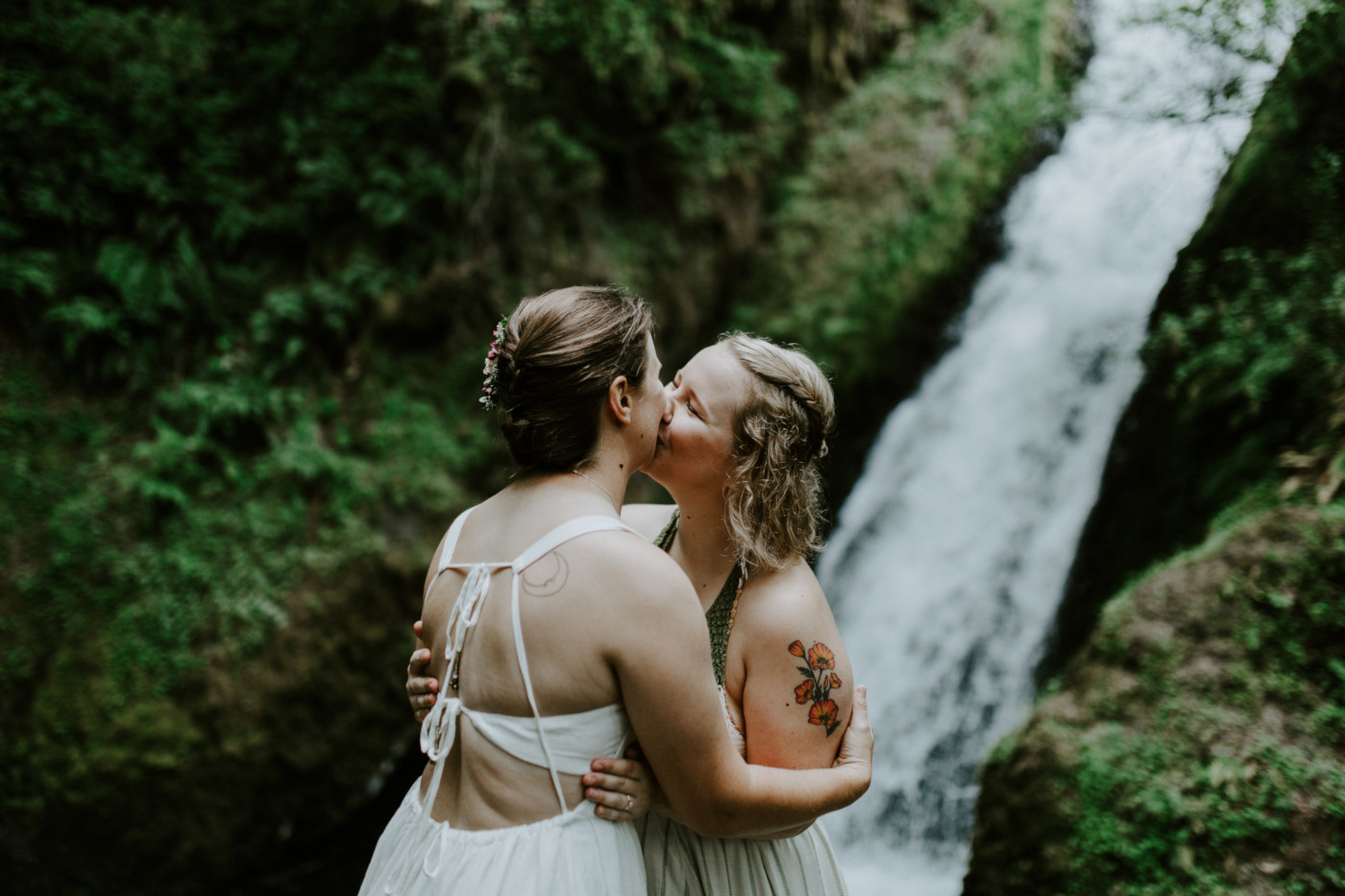 Audrey and Kate's first kiss as bride and bride. Elopement wedding photography at Bridal Veil Falls by Sienna Plus Josh.