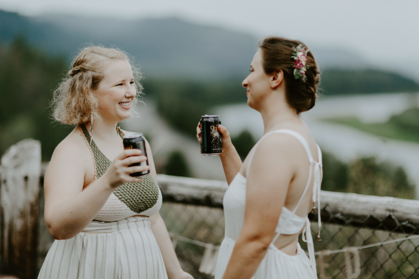 Kate and Audrey toast after their elopement. Elopement wedding photography at Bridal Veil Falls by Sienna Plus Josh.