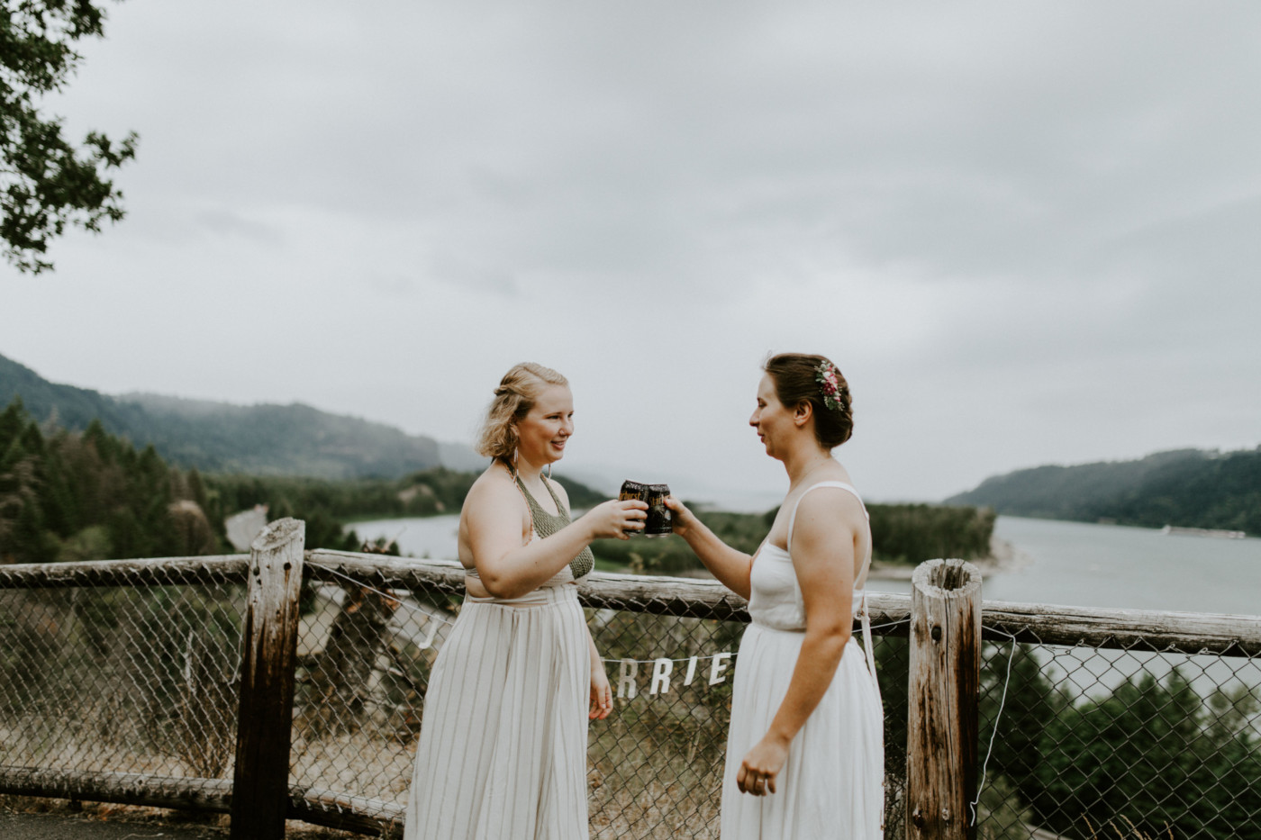 Audrey and Kate toast after their ceremony. Elopement wedding photography at Bridal Veil Falls by Sienna Plus Josh.