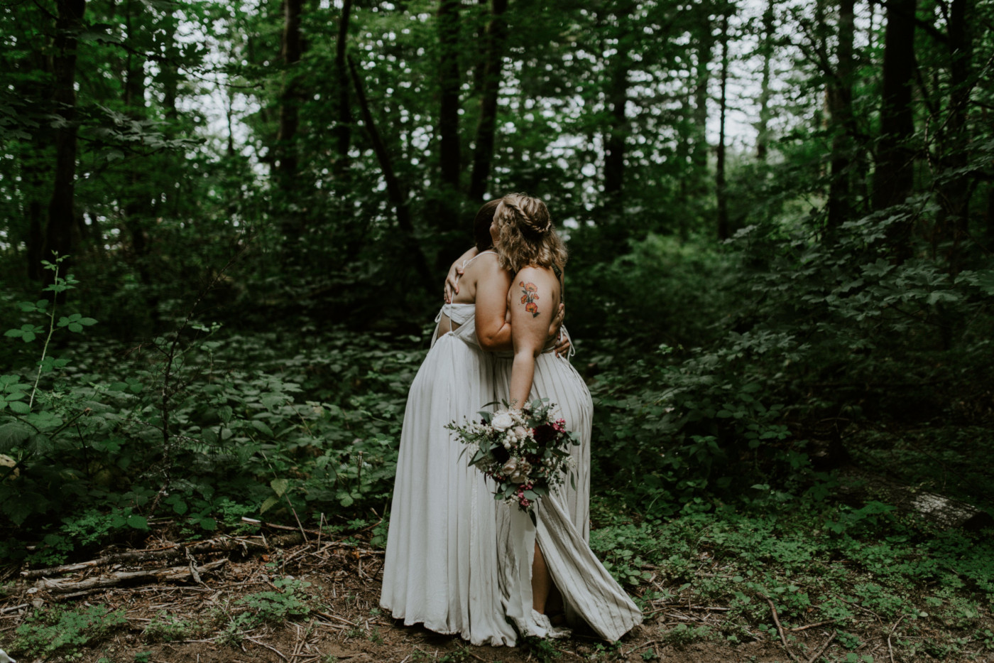 Kate and Audrey hug. Elopement wedding photography at Bridal Veil Falls by Sienna Plus Josh.