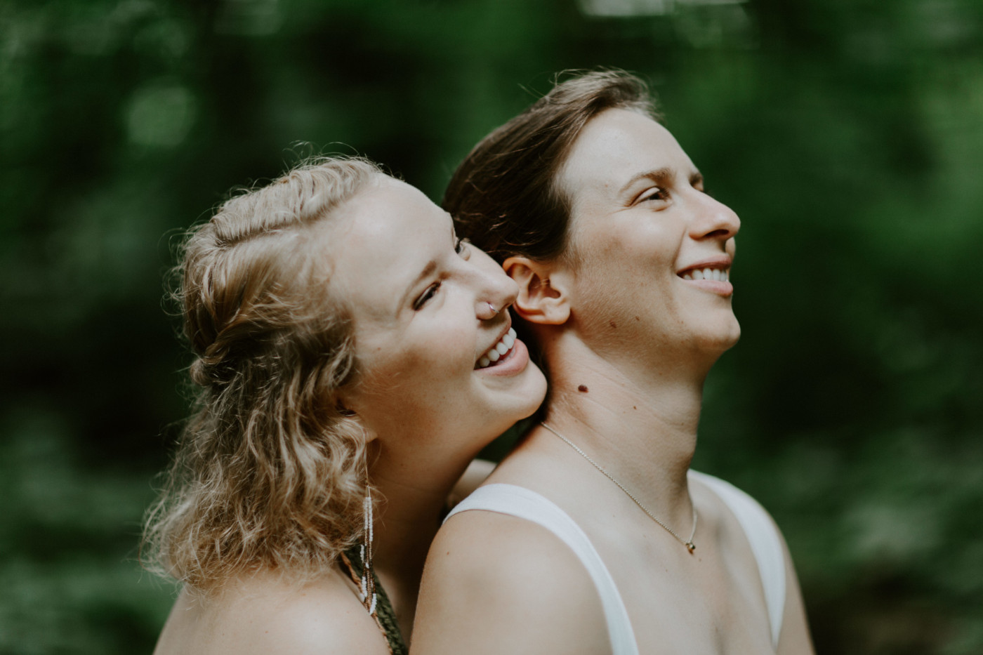 Kate and Audrey laugh. Elopement wedding photography at Bridal Veil Falls by Sienna Plus Josh.