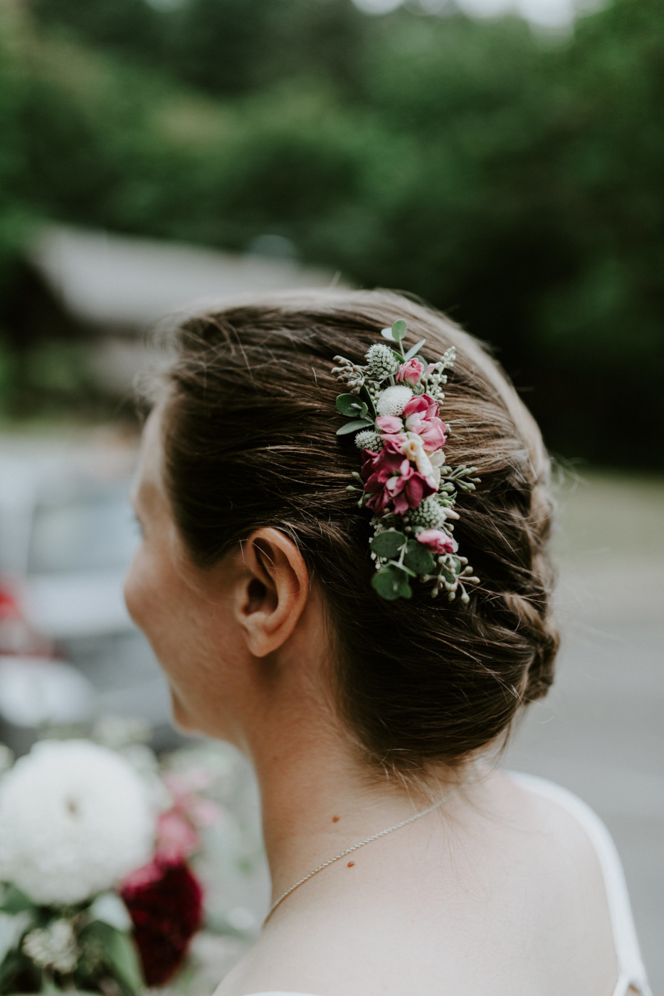 Audrey has her hair bouquet. Elopement wedding photography at Bridal Veil Falls by Sienna Plus Josh.