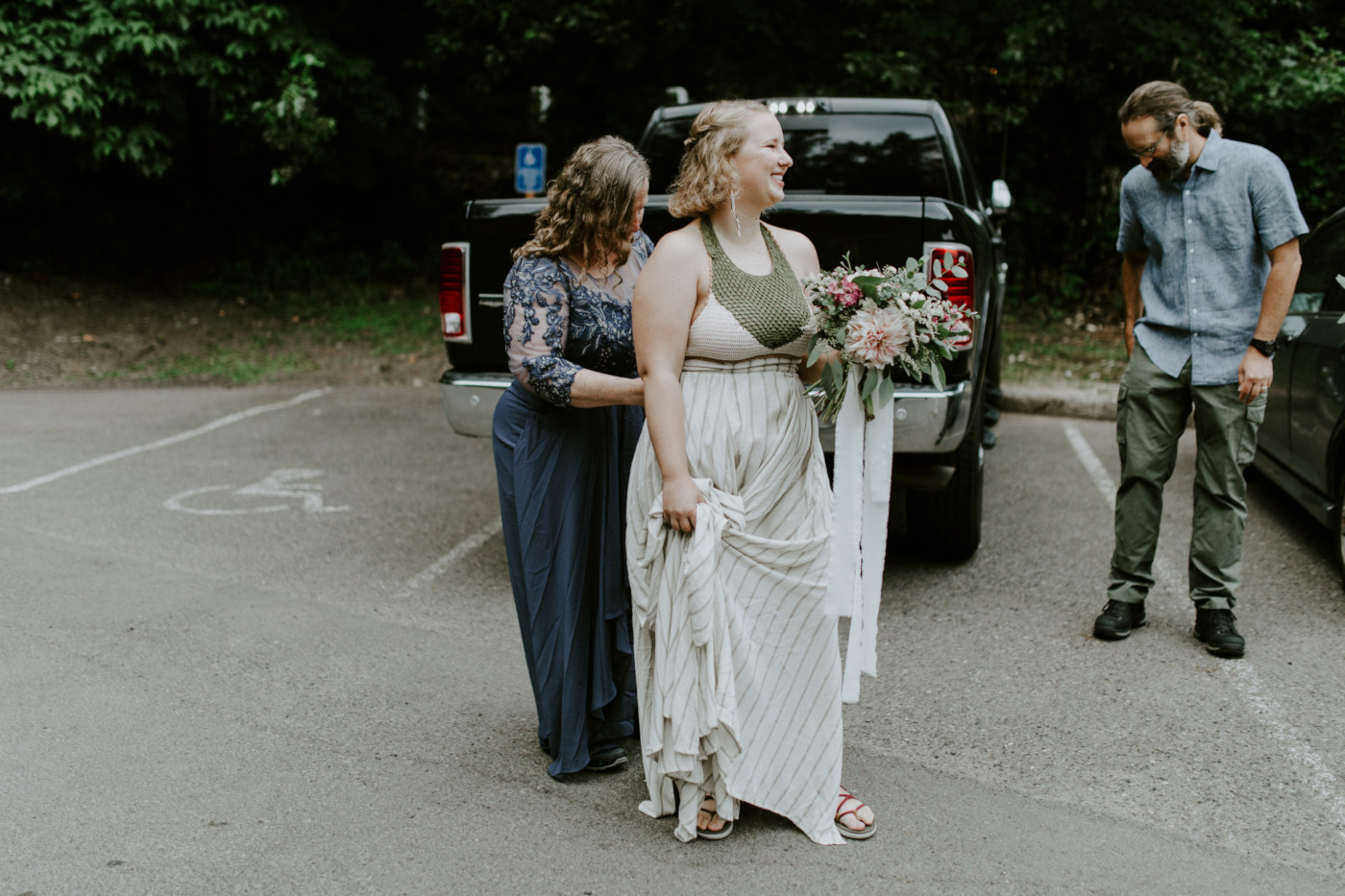 Kate's mom helps her with her wedding dress. Elopement wedding photography at Bridal Veil Falls by Sienna Plus Josh.