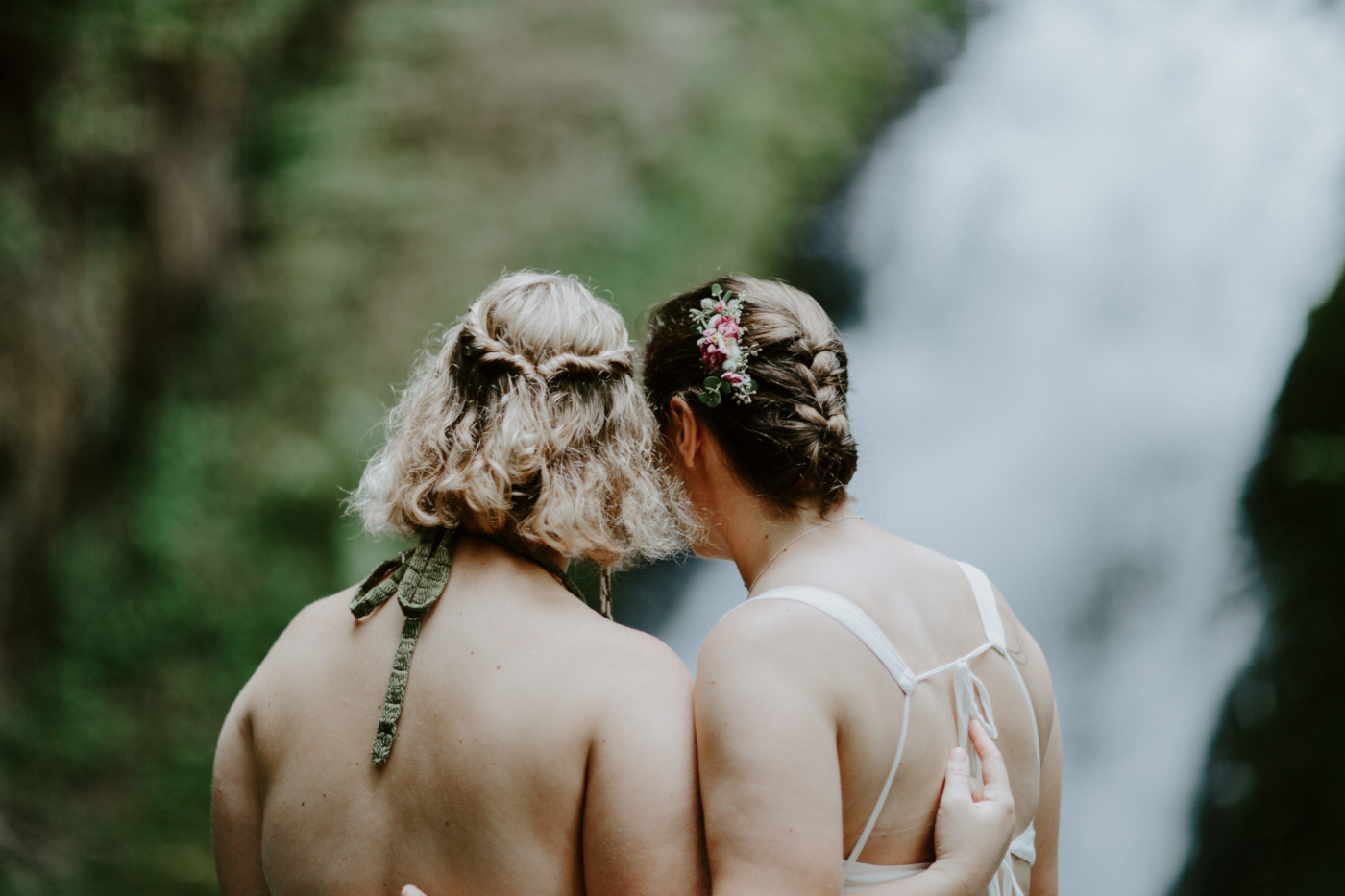 Kate and Audrey stand side by side. Elopement wedding photography at Bridal Veil Falls by Sienna Plus Josh.