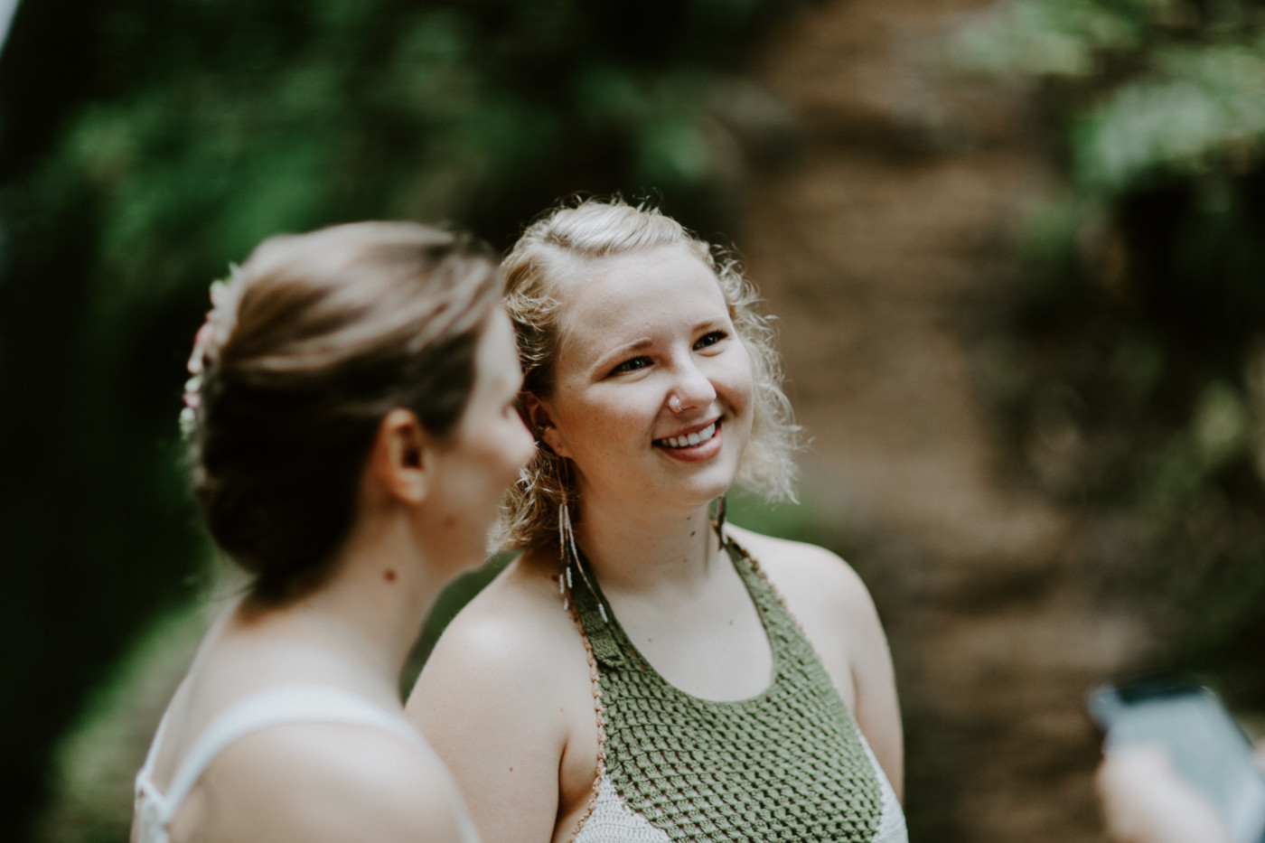 Kate listens to her mom officiate her elopement. Elopement wedding photography at Bridal Veil Falls by Sienna Plus Josh.