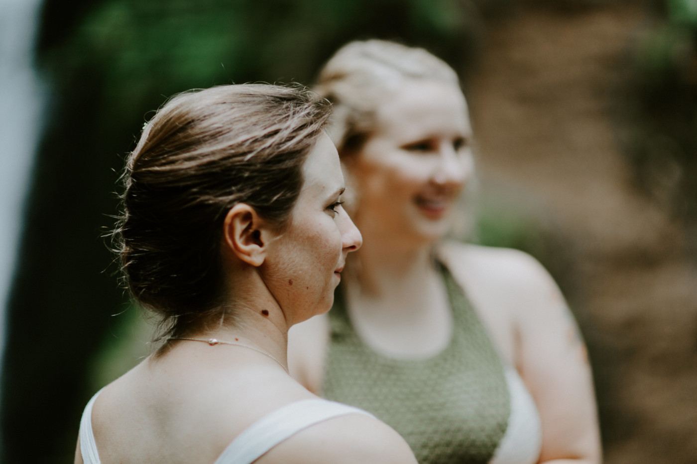 Audrey stands next to Kate. Elopement wedding photography at Bridal Veil Falls by Sienna Plus Josh.