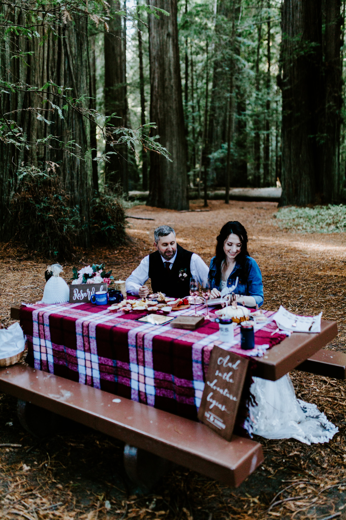 Hannah and Tim sit for their elopement picnic.