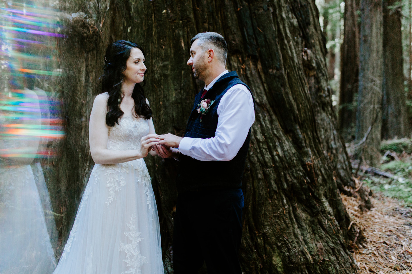 Hannah and Tim hold hands at their elopement.