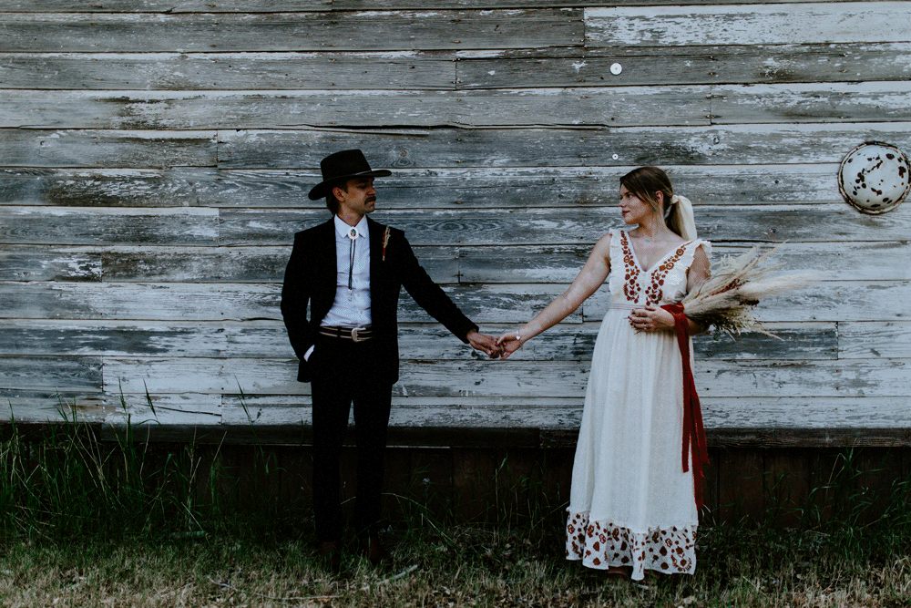 Emily and Greyson go in for a hug. Elopement photography in the Central Oregon desert by Sienna Plus Josh.