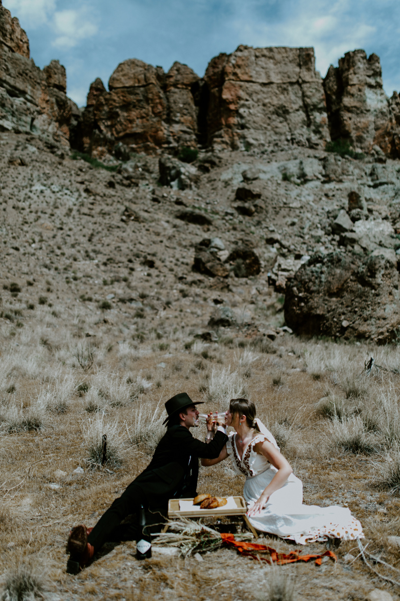 Greyson and Emily drink. Elopement photography in the Central Oregon desert by Sienna Plus Josh.