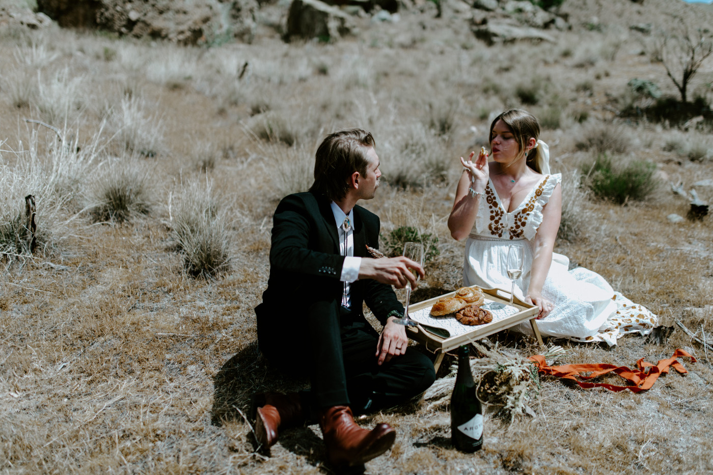 Emily and Greyson have a picnic. Elopement photography in the Central Oregon desert by Sienna Plus Josh.