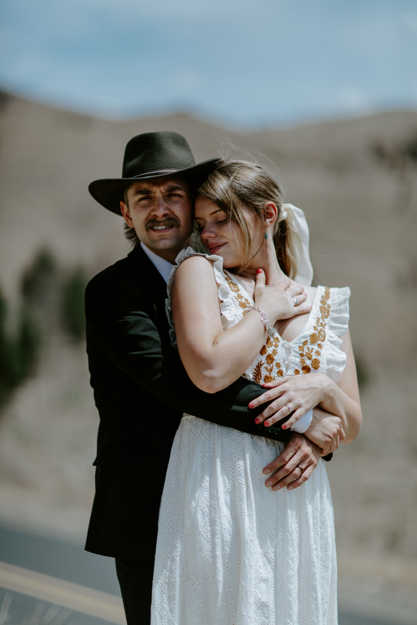 Emily and Greyson hug. Elopement photography in the Central Oregon desert by Sienna Plus Josh.