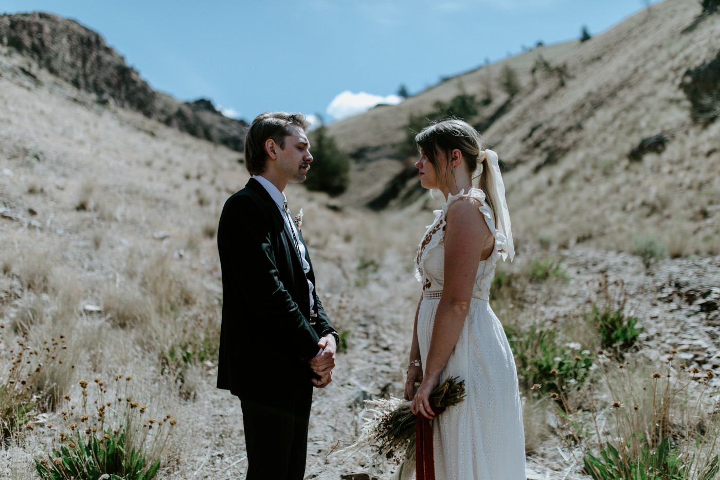 Greyson and Emily reciting vows. Elopement photography in the Central Oregon desert by Sienna Plus Josh.