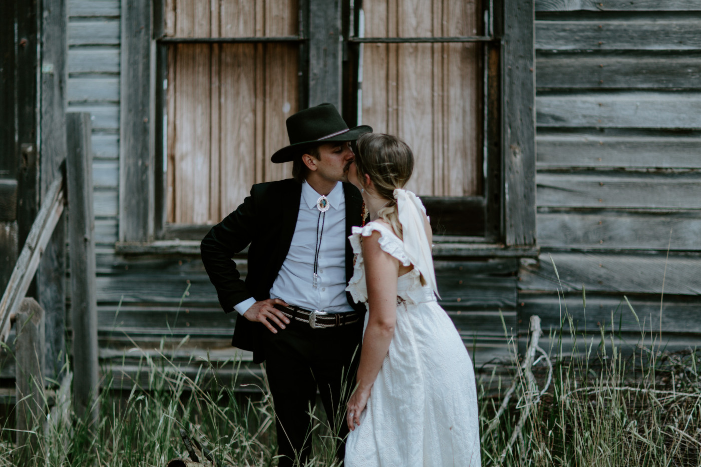 Emily and Greyson kiss. Elopement photography in the Central Oregon desert by Sienna Plus Josh.