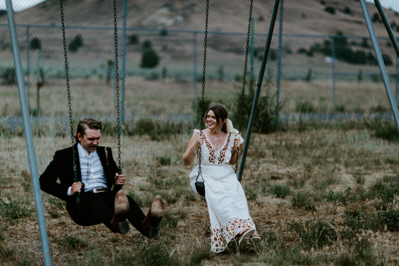 Greyson and Emily swing. Elopement photography in the Central Oregon desert by Sienna Plus Josh.