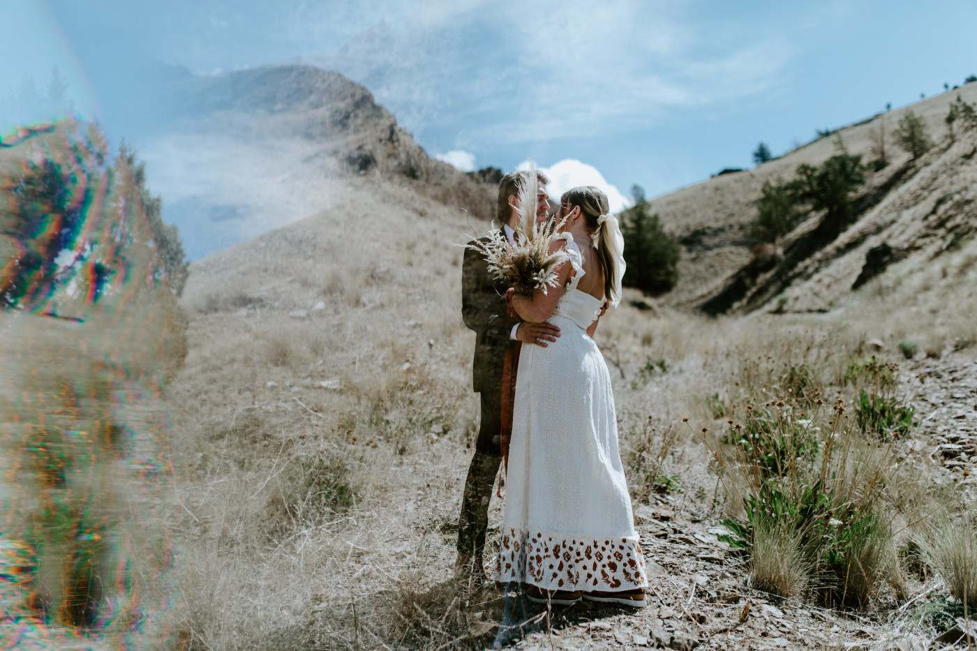Emily and Greyson kiss. Elopement photography in the Central Oregon desert by Sienna Plus Josh.