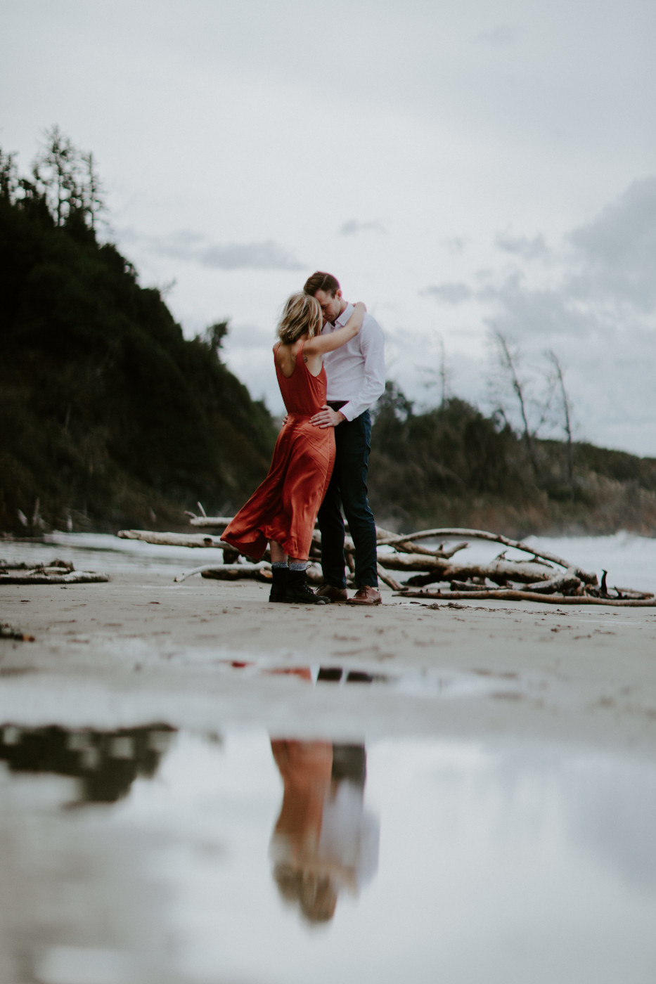 Chelsey and Billy share a moment on the beach. Elopement wedding photography at Cannon Beach by Sienna Plus Josh.