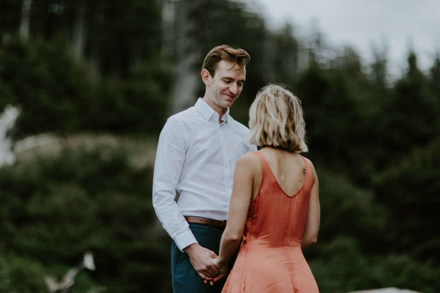Chelsey laughs with Billy. Elopement wedding photography at Cannon Beach by Sienna Plus Josh.
