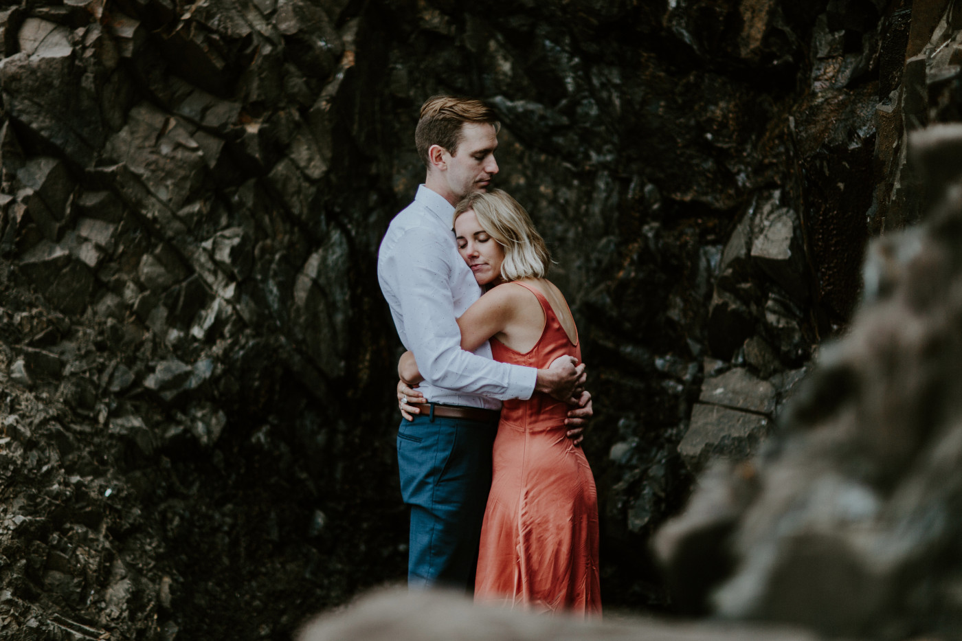 Chelsey and Billy share a hug. Elopement wedding photography at Cannon Beach by Sienna Plus Josh.
