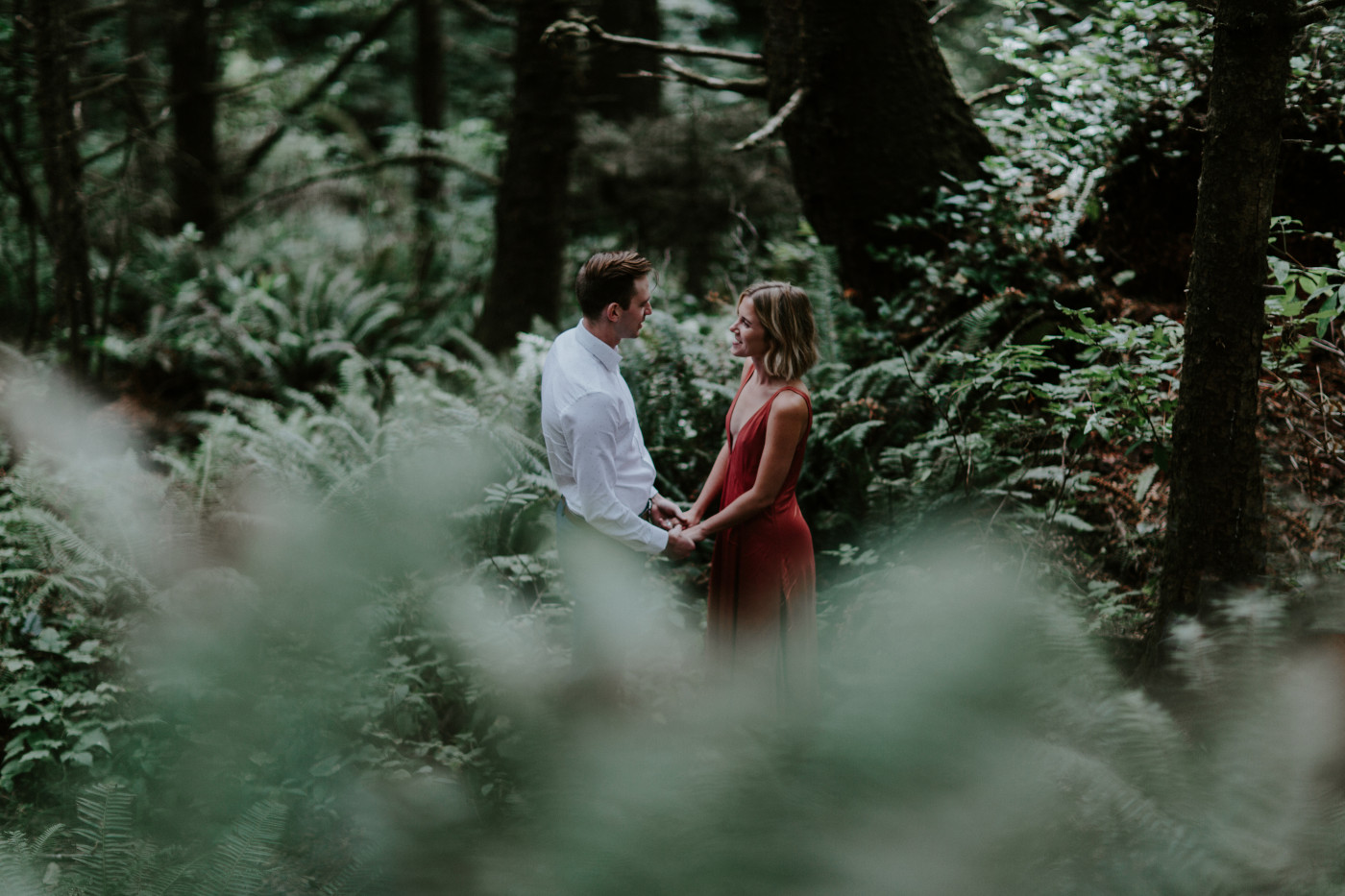 Chelsey and Billy stand together in the forest near Cannon Beach. Elopement wedding photography at Cannon Beach by Sienna Plus Josh.