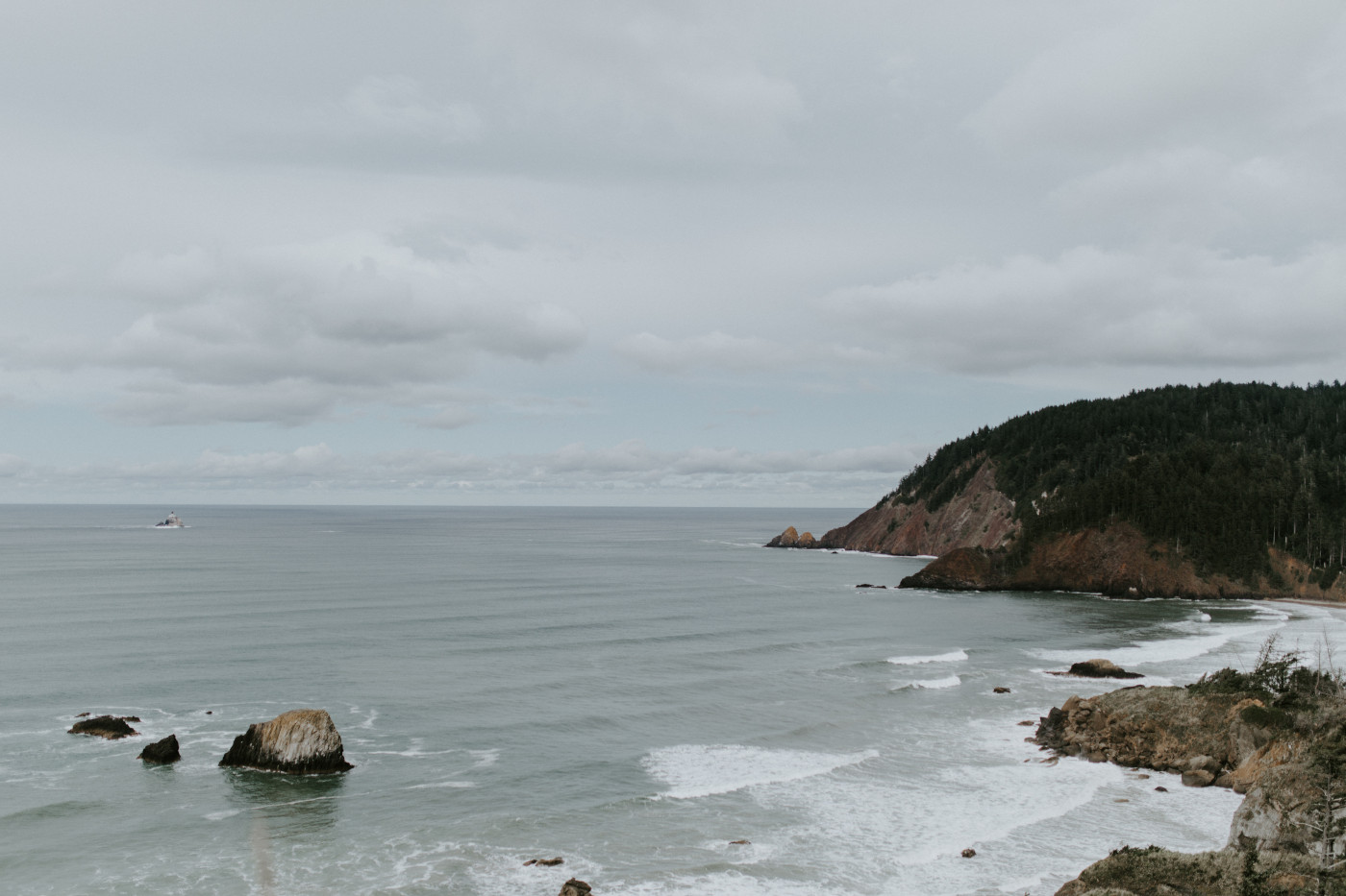 A view of the cliffs at Cannon Beach. Elopement wedding photography at Cannon Beach by Sienna Plus Josh.