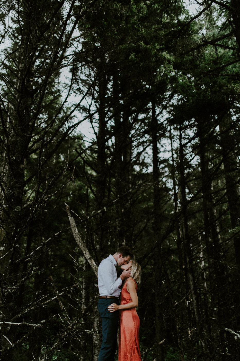 Chelsey and Billy kiss in front of the trees. Elopement wedding photography at Cannon Beach by Sienna Plus Josh.