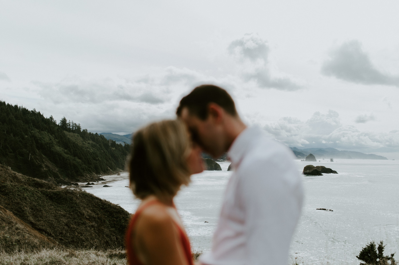 Billy and Chelsey go in for a kiss. Elopement wedding photography at Cannon Beach by Sienna Plus Josh.