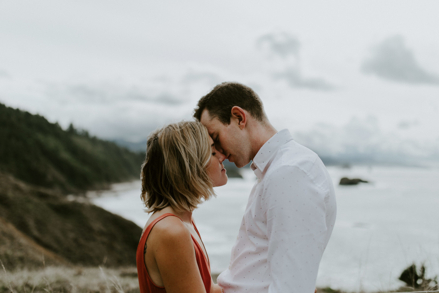Chelsey and Billy stand near Cannon Beach. Elopement wedding photography at Cannon Beach by Sienna Plus Josh.