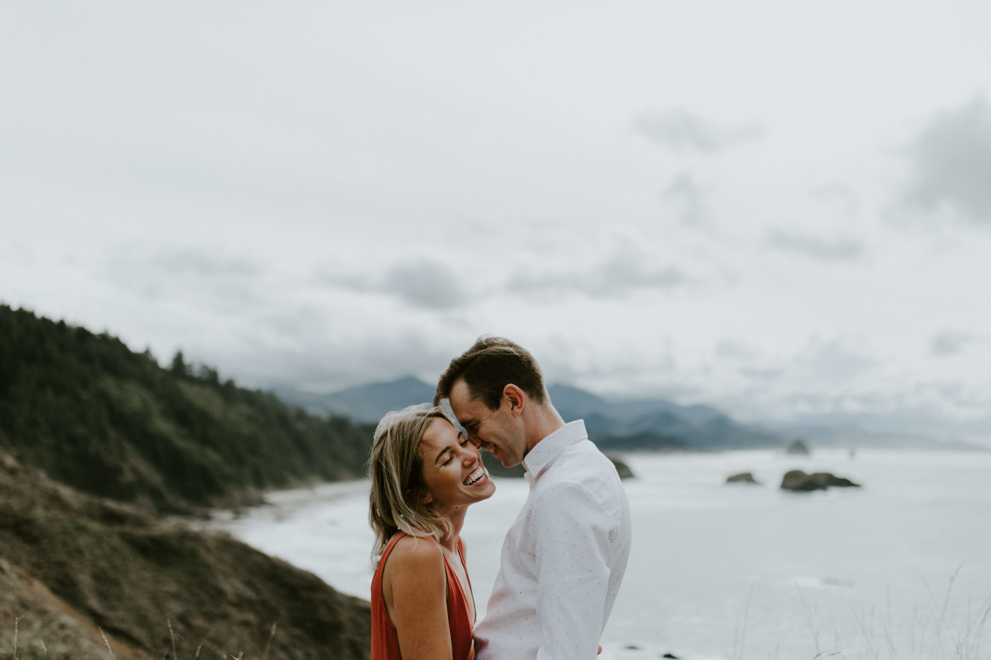 Chelsey laughs with Billy. Elopement wedding photography at Cannon Beach by Sienna Plus Josh.