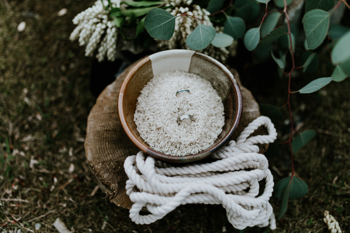 Lennie and Allison's rings sit in a bowl at their ceremony. Elopement photography at Columbia River Gorge by Sienna Plus Josh.