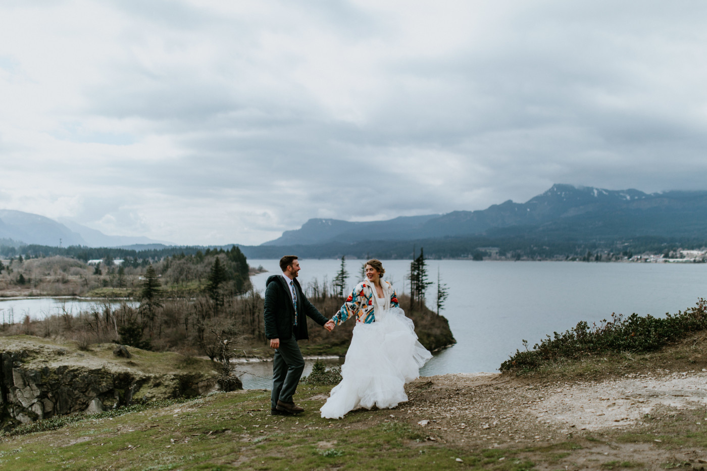Allison and Lennie walk along the cliff. Elopement photography at Columbia River Gorge by Sienna Plus Josh.
