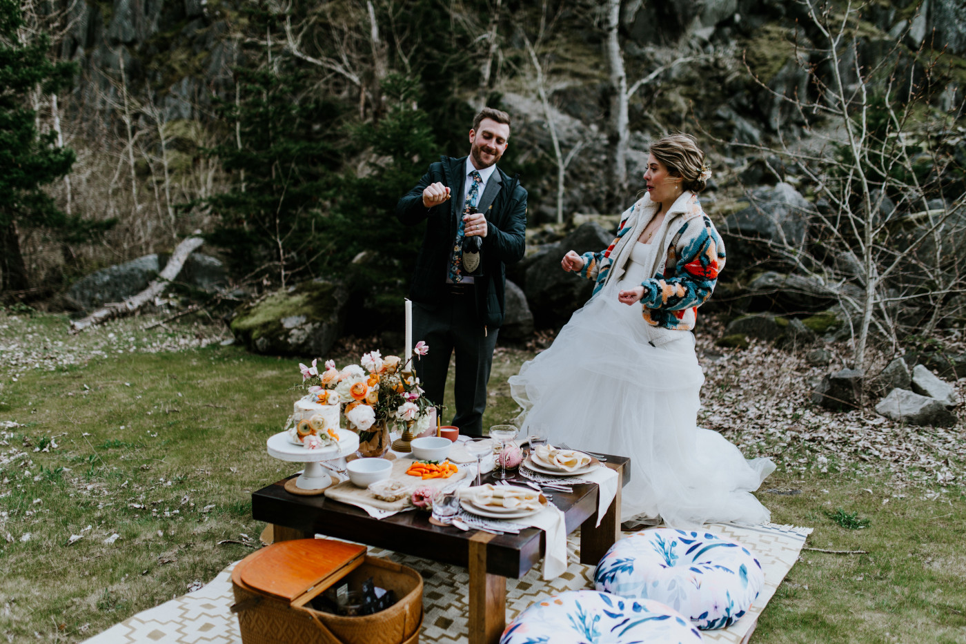 Allison and Lennie pop champagne at their elopement dinner picnic. Elopement photography at Columbia River Gorge by Sienna Plus Josh.