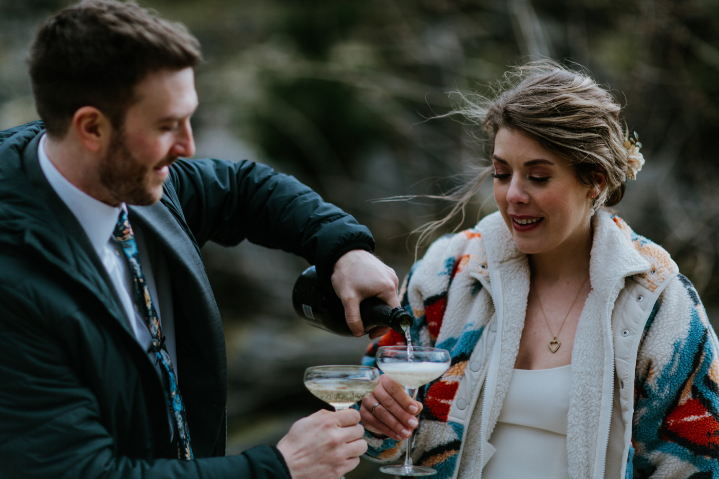 Allison and Lennie pour champagne. Elopement photography at Columbia River Gorge by Sienna Plus Josh.