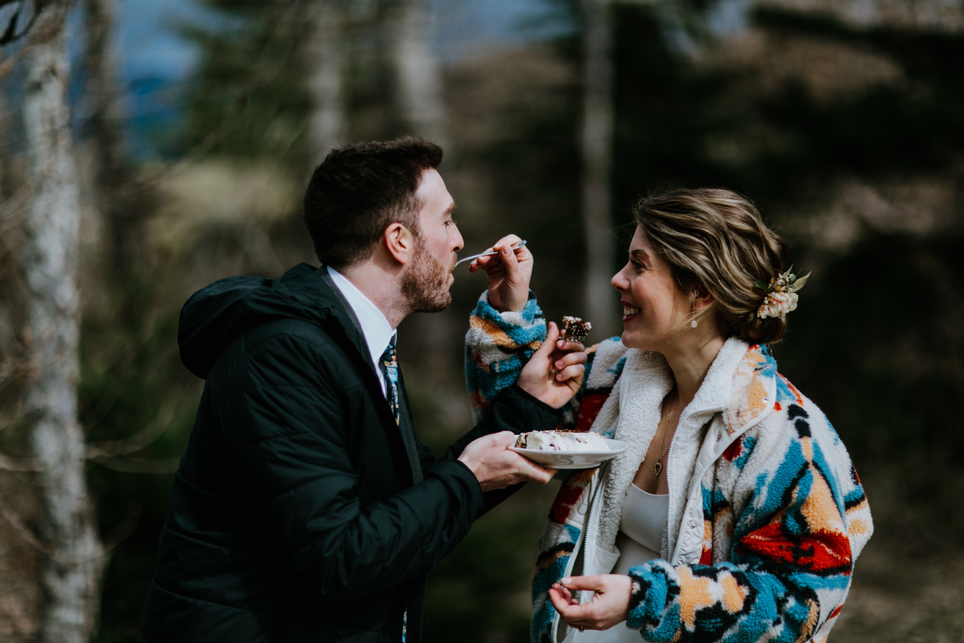 Lennie and Allison feed each other cake. Elopement photography at Columbia River Gorge by Sienna Plus Josh.