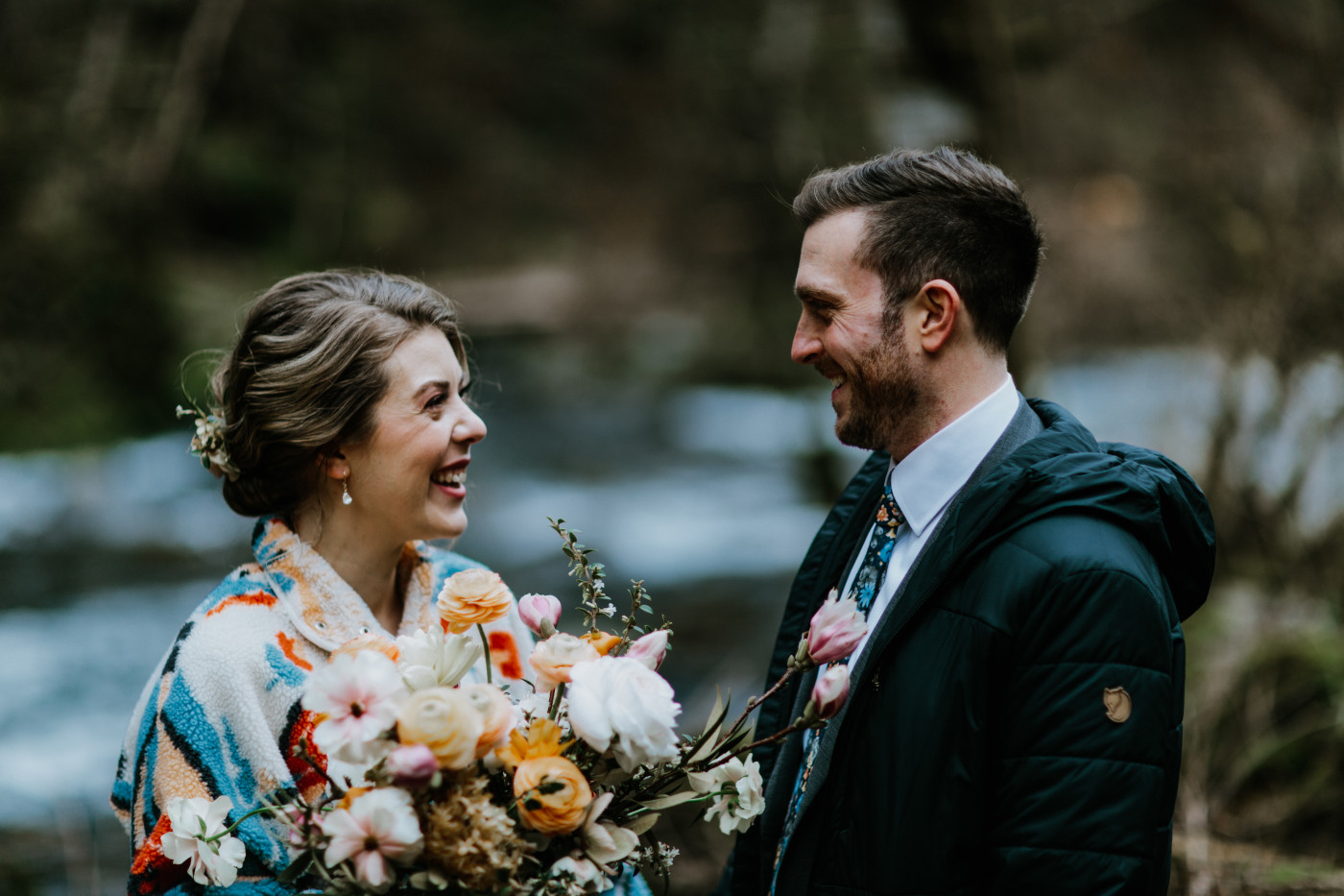Allison and Lennie smile at each other on a trail in the Columbia River Gorge. Elopement photography at Columbia River Gorge by Sienna Plus Josh.
